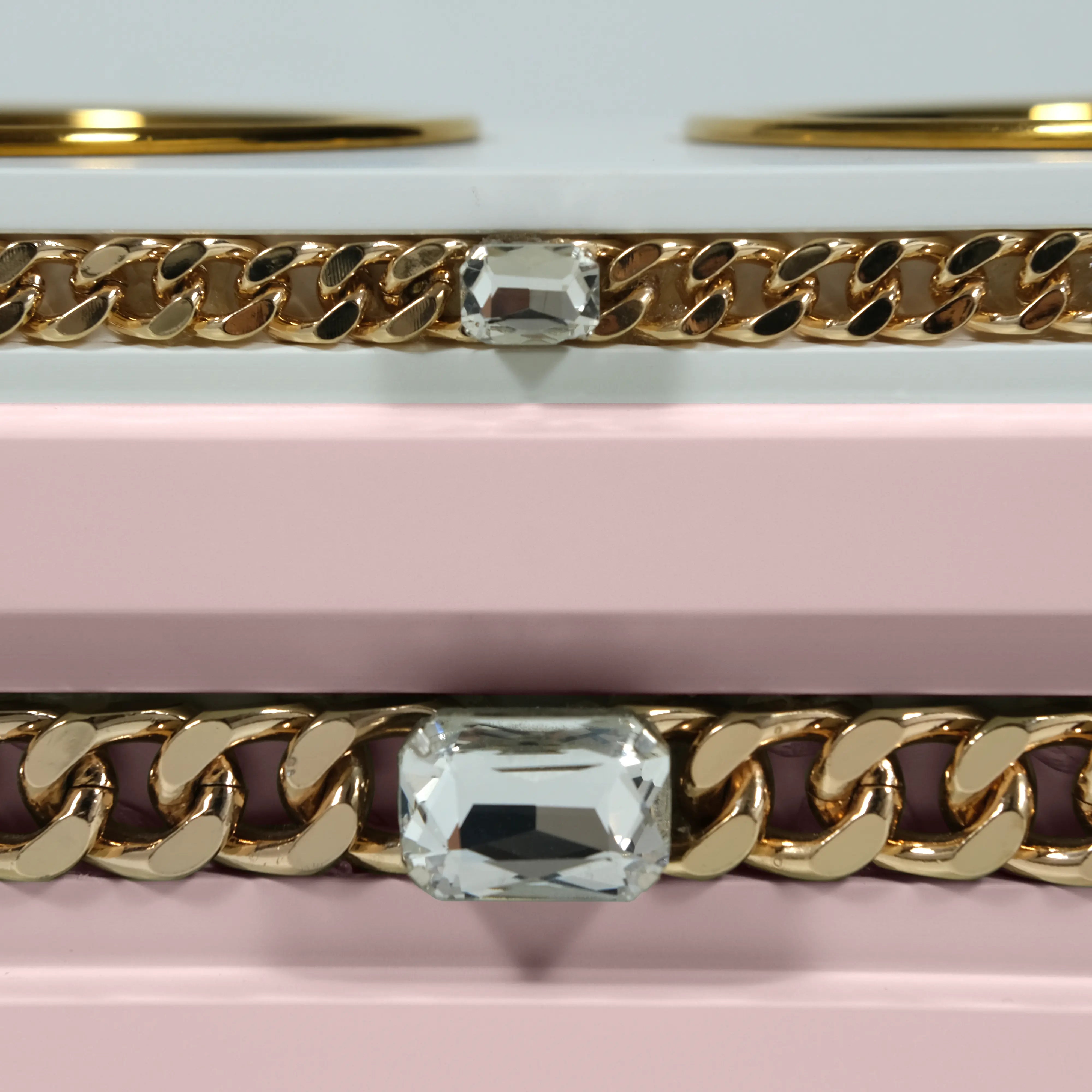 "Close-up detail of the jewelry-grade crystal and haute couture chain application on the FUROAR Nene modern designer station."