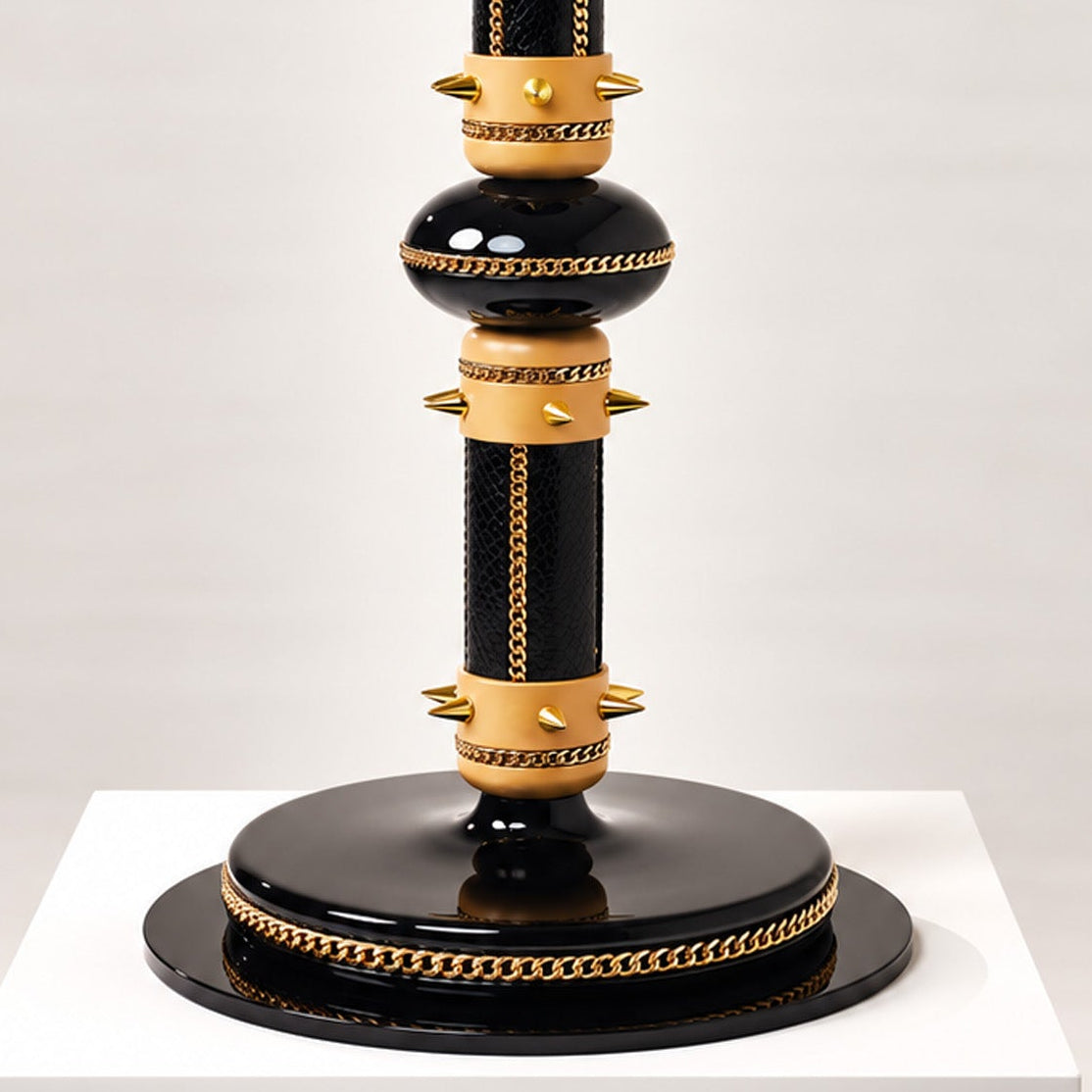 Detail shot of the ARCHON base with gold chains and gold studs 
