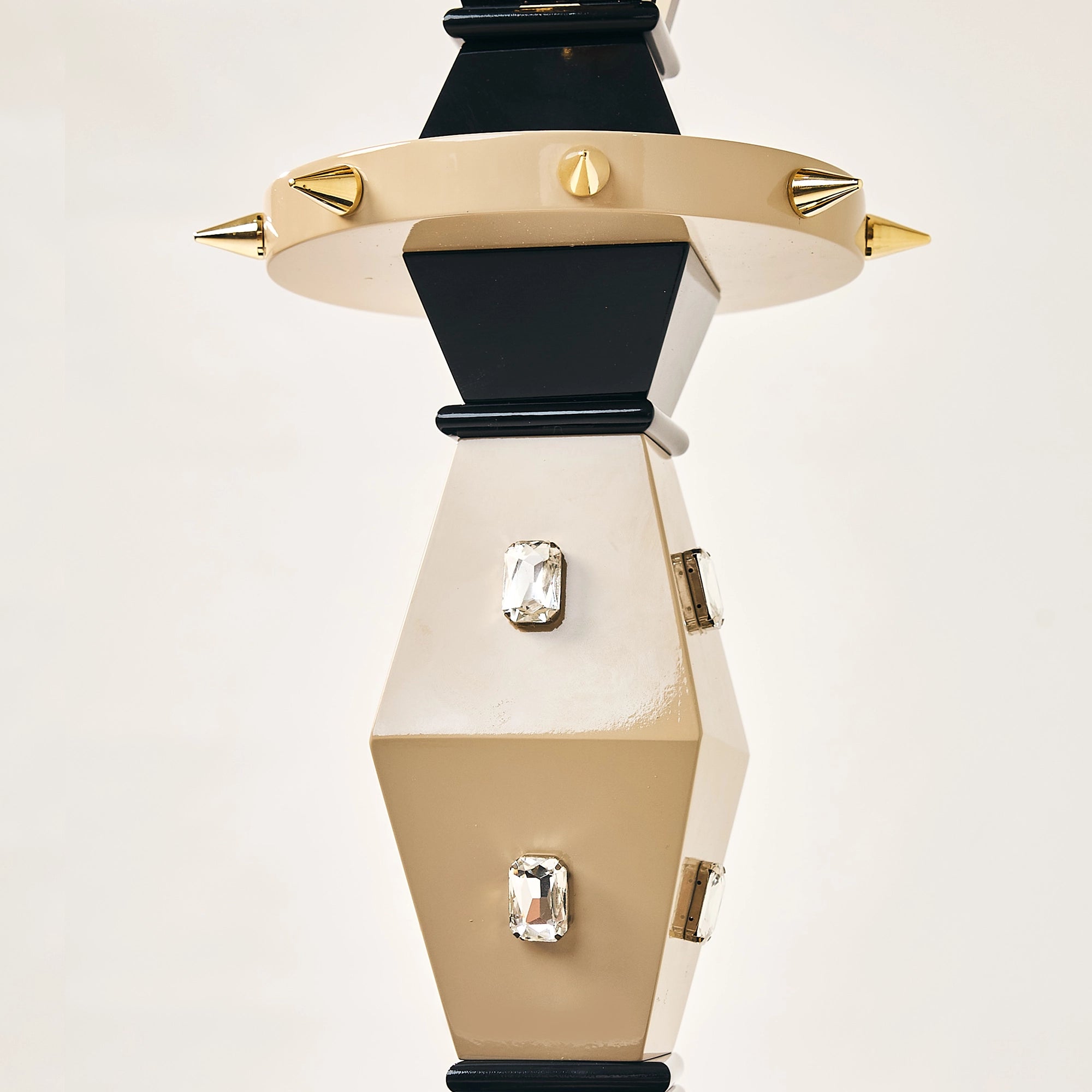 Close-up of the crystal accents and spiked collar on the FUROAR Tsar falcon stand.