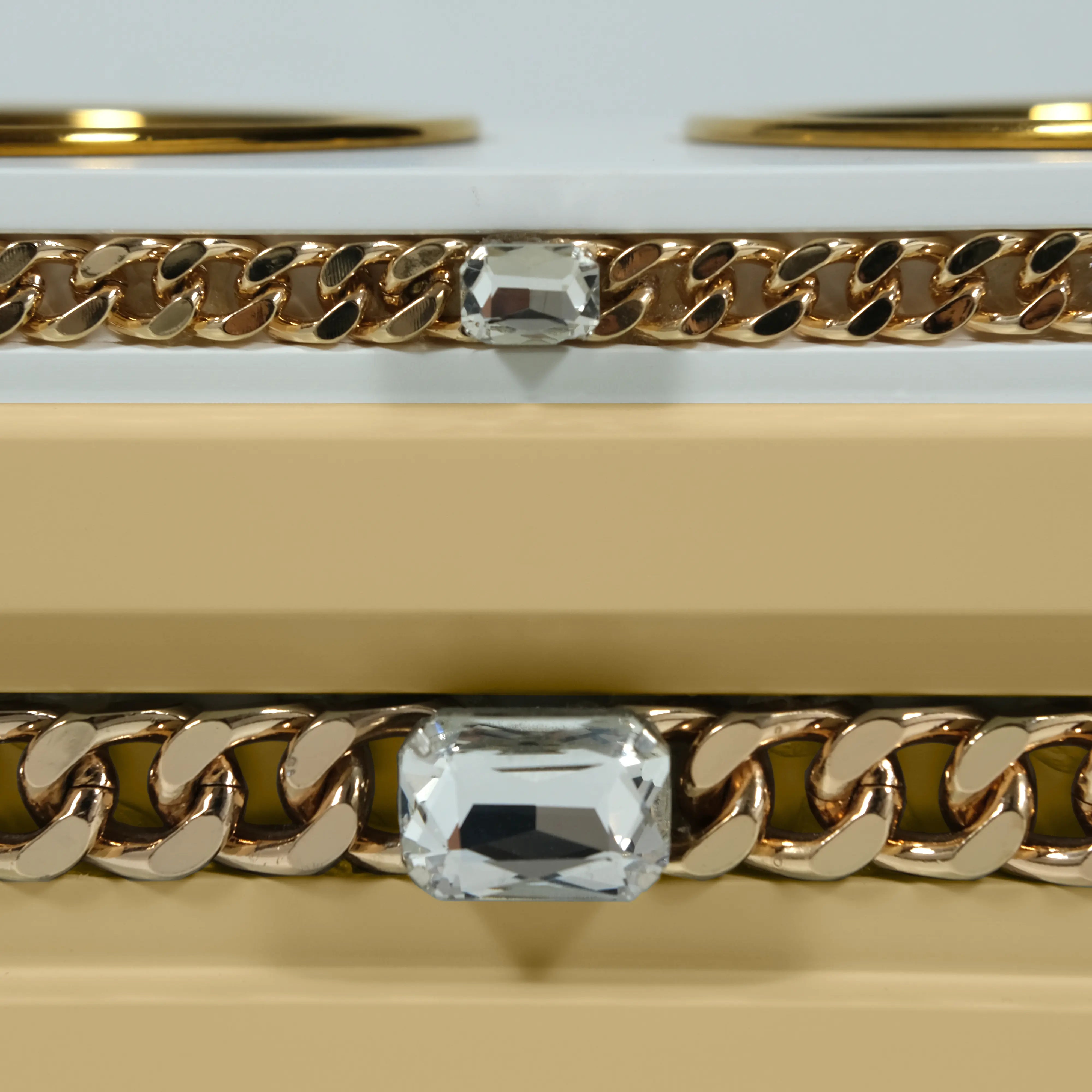 Close-up of jewelry-grade crystal and gold chain detail on FUROAR Biscuit dining station.