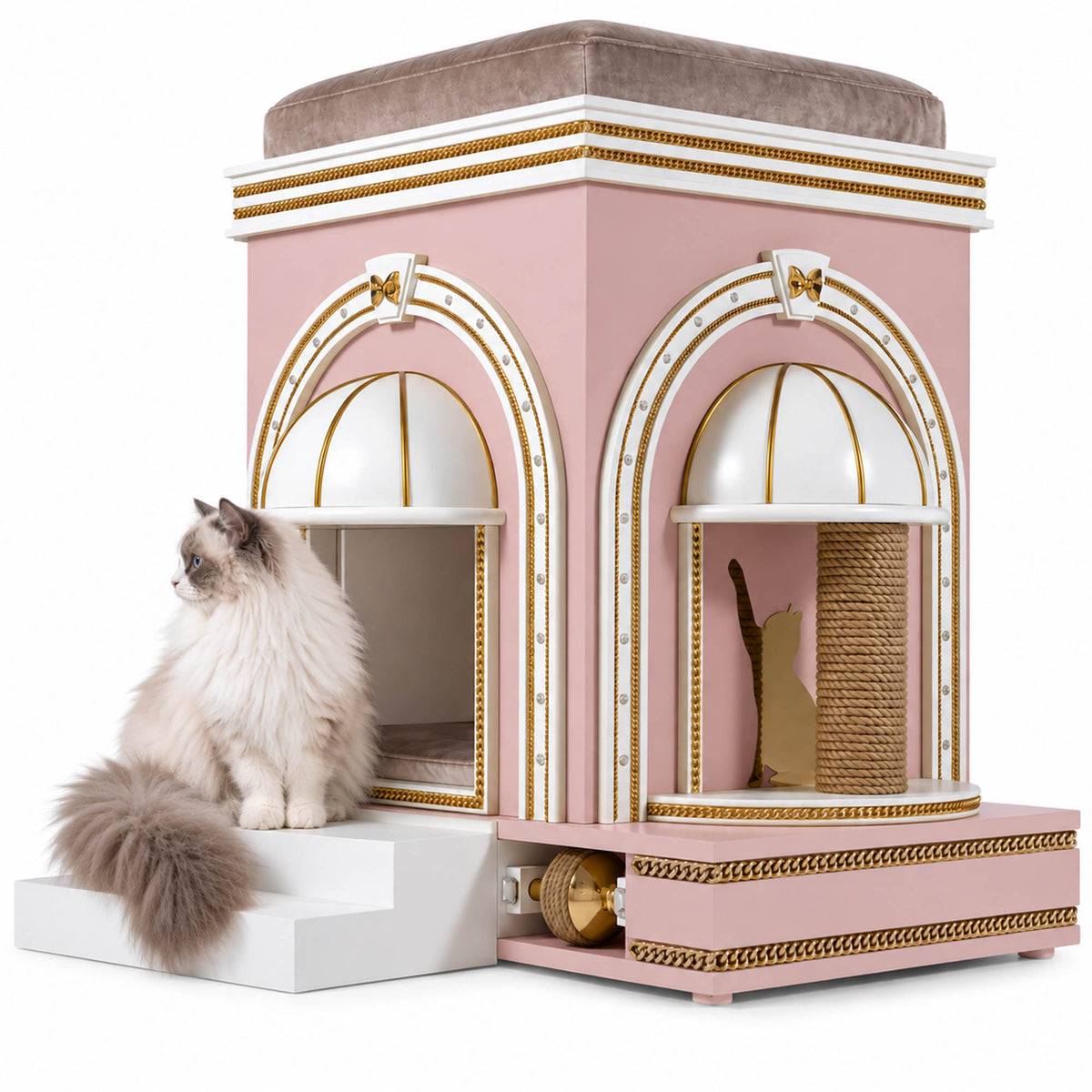 A fluffy long-haired cat sits on the left side of a decorative pink and white cat house with gold trim. The cat house features two arched entryways, a top platform, a scratching post inside, and a lower storage compartment with a bell.