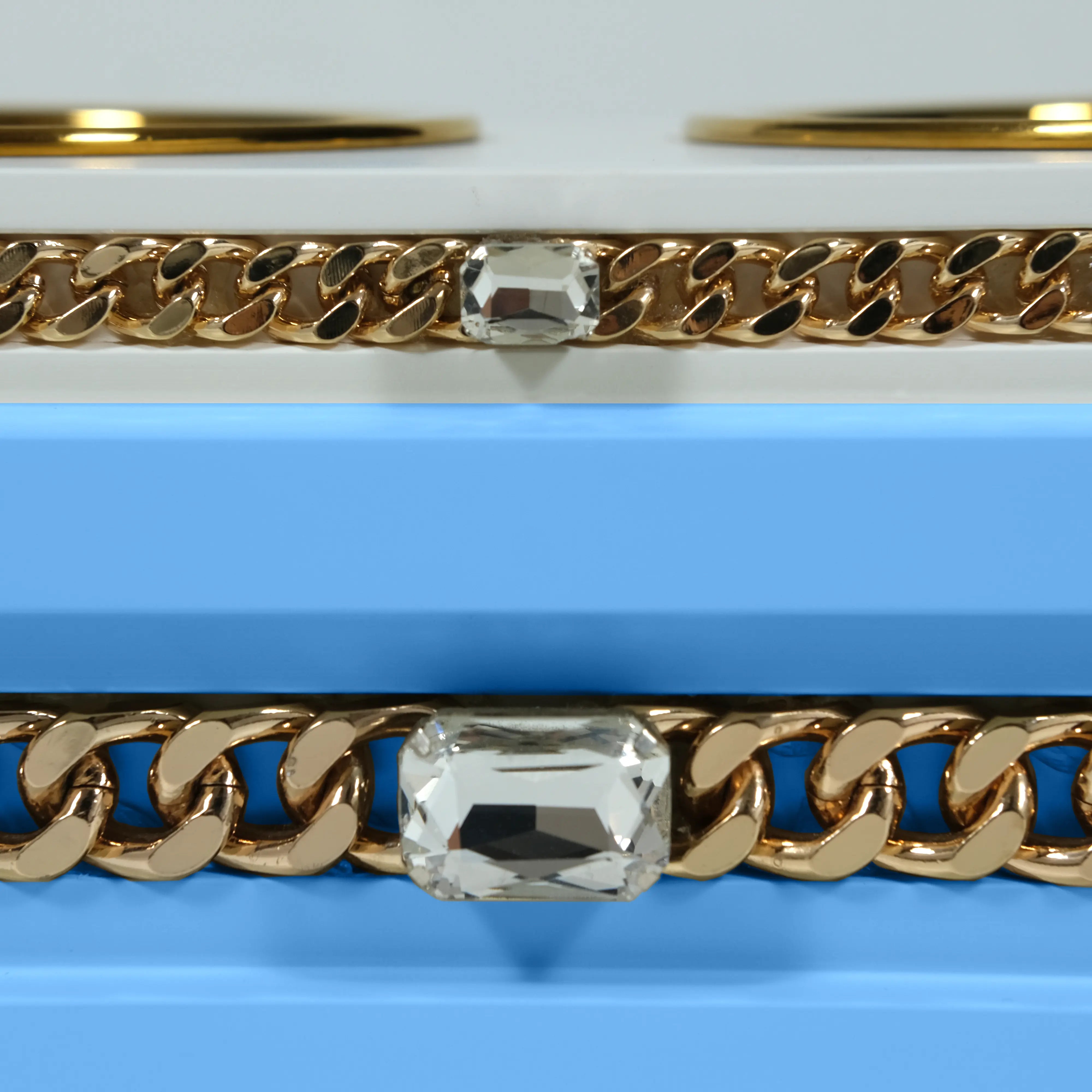 "Close-up detail of the jewelry-grade crystal and haute couture chain application on the FUROAR Lucky modern designer station."
