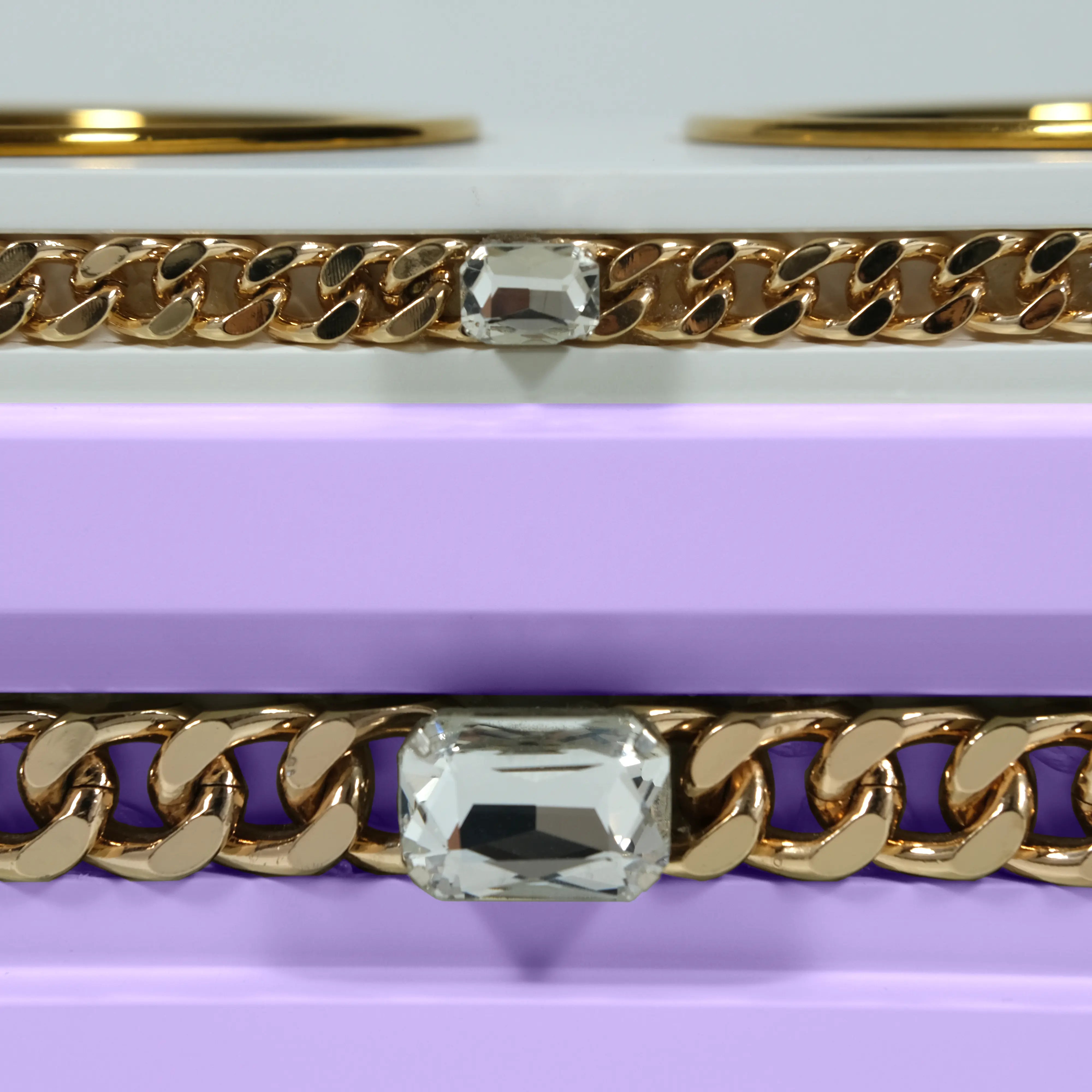 "Close-up detail of the jewelry-grade crystal and haute couture chain application on the FUROAR Pixie modern designer station."