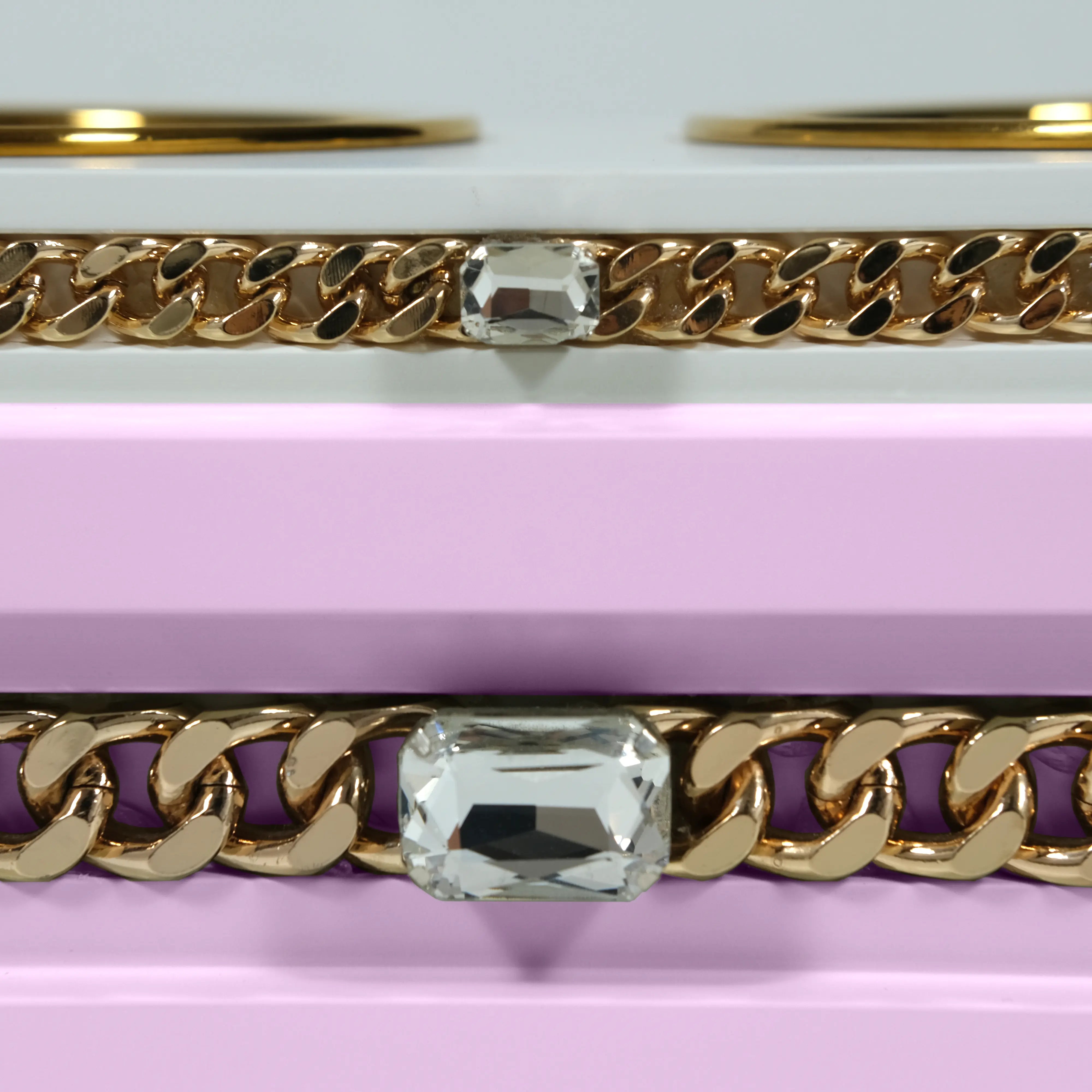 "Close-up detail of the jewelry-grade crystal and haute couture chain application on the FUROAR Prissy modern designer station."