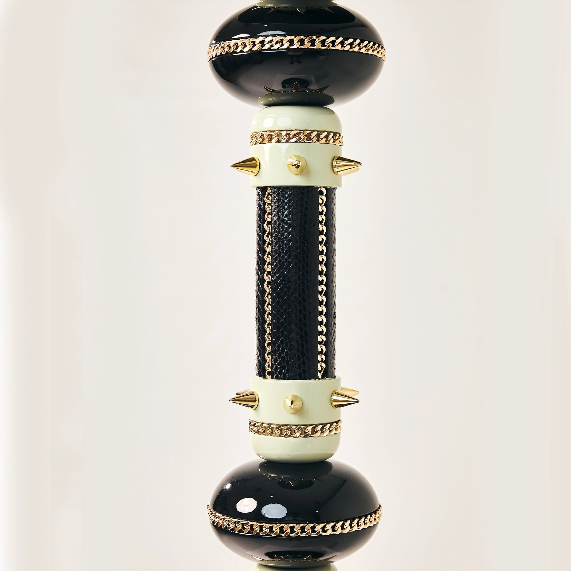 Close-up of the textured central column and black spheres on a FUROAR falcon perch.