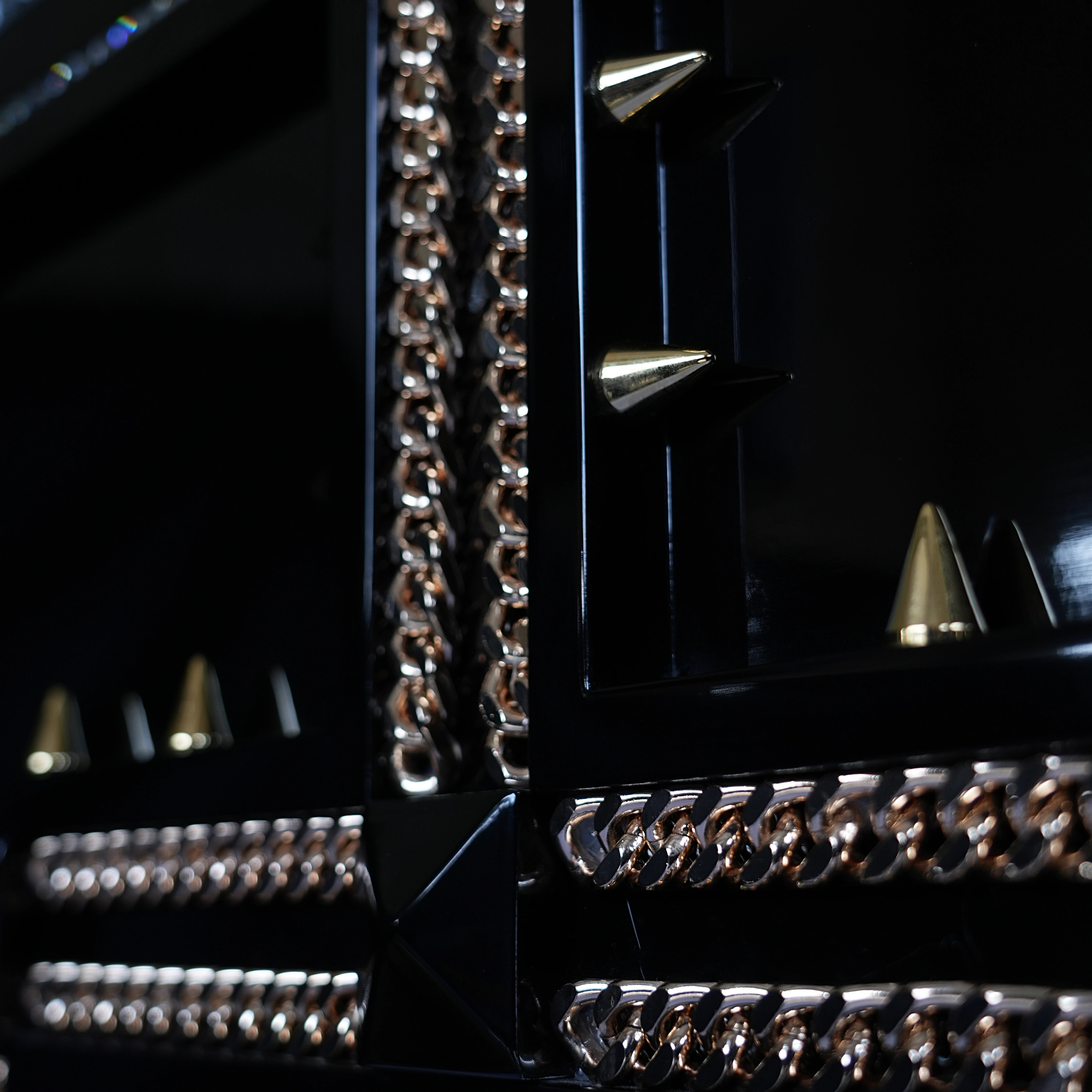 Jewelry application and golden chains on the bespoke Beverly Hills Medium indoor dog house.